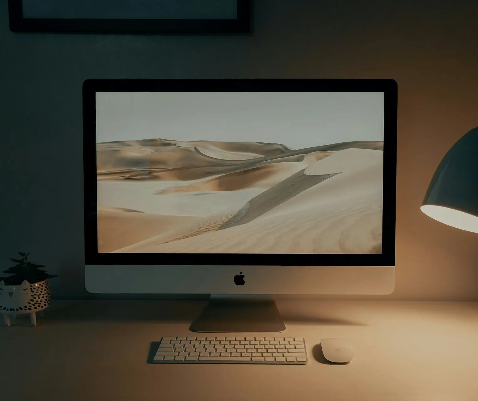 silver imac on brown wooden table